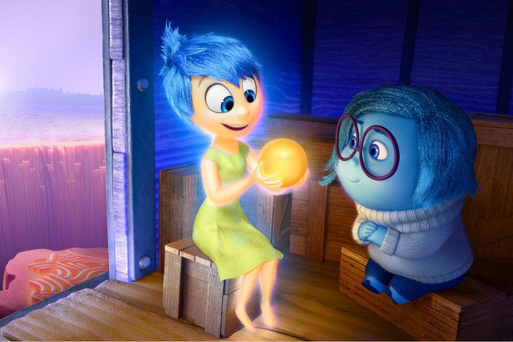 Joy shows Sadness a bright ball in Inside Out.
