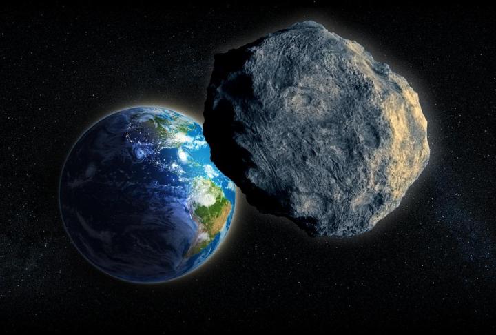 An illustration of an asteroid hurtling past Earth.