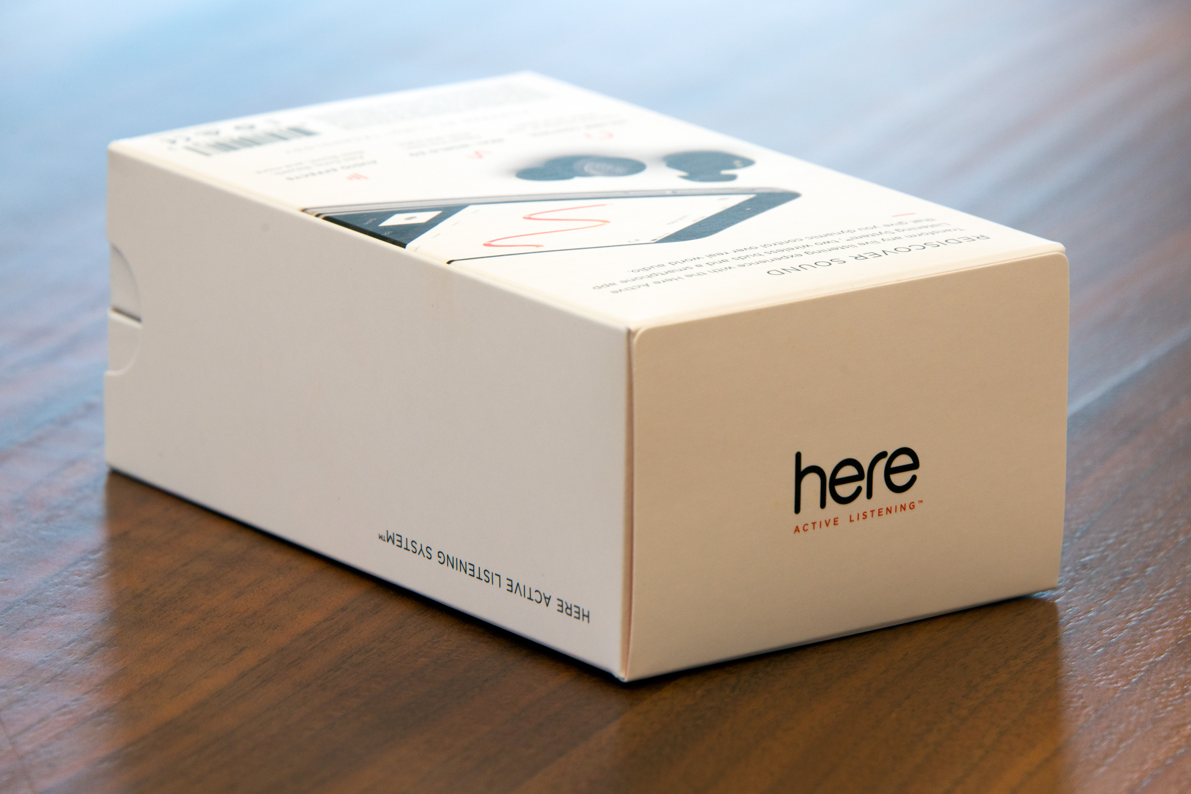 here active listening system hands on earbuds box2