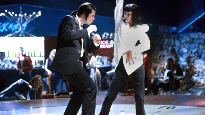 John Travolta and Uma Thurman twist and shake onstage.