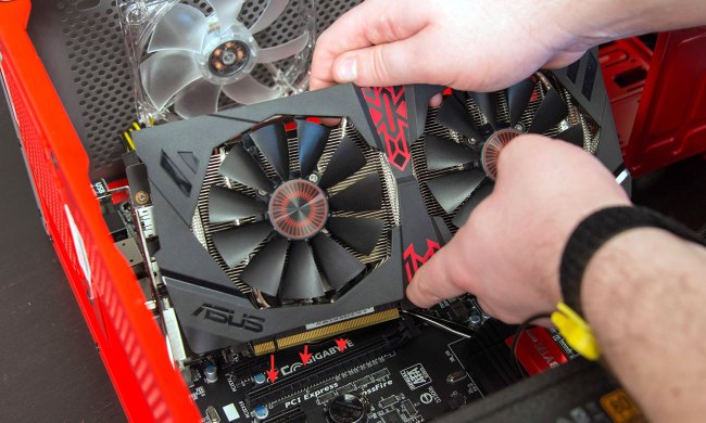 Graphics card going into motherboard slot.