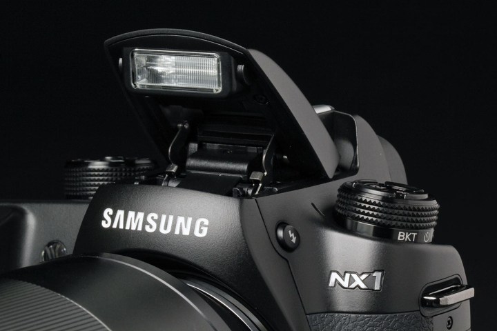 samsung exit camera business nx1 flash