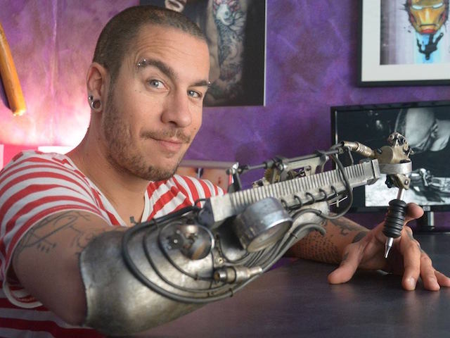 tattoo gun prosthetic arm jc sheitan tenet