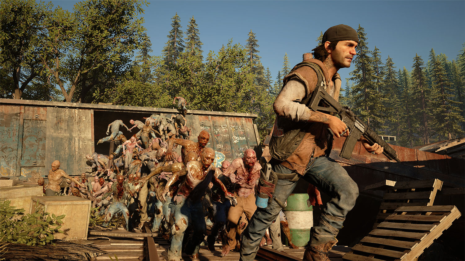 Days Gone's Deacon runs from a horde of zombies.