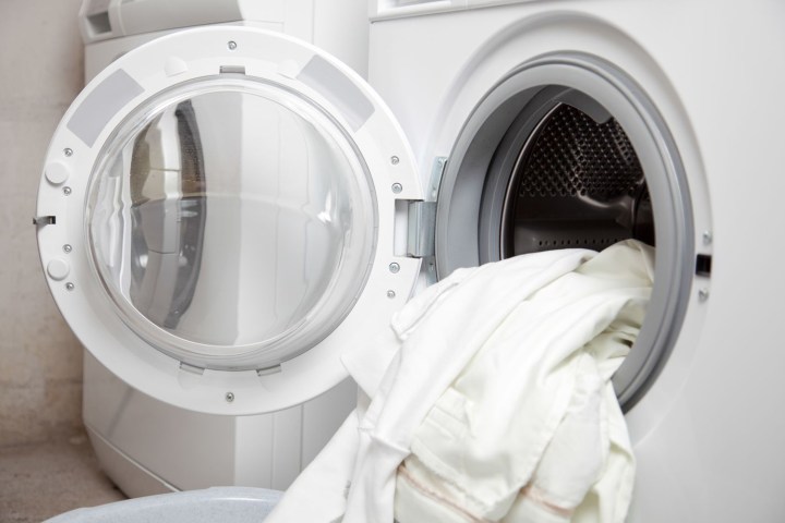 counterfeit laundry detergent tide gain downy 20915027  some dirty clothes in the washing machine