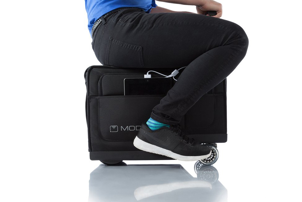 Airport On a Modobag Motorized Suitcase 
