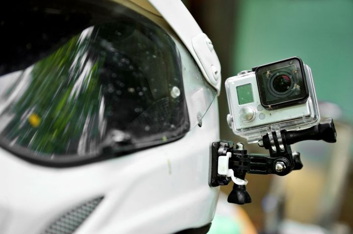 study says action camera sales will triple 33743222  with dead insects mounted on a motorcycle helmet