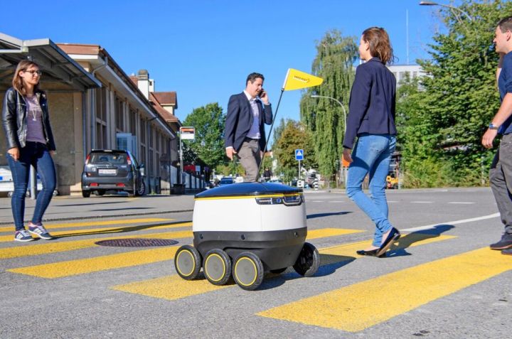 san francisco delivery robot starship on crosswalk with pedestrians