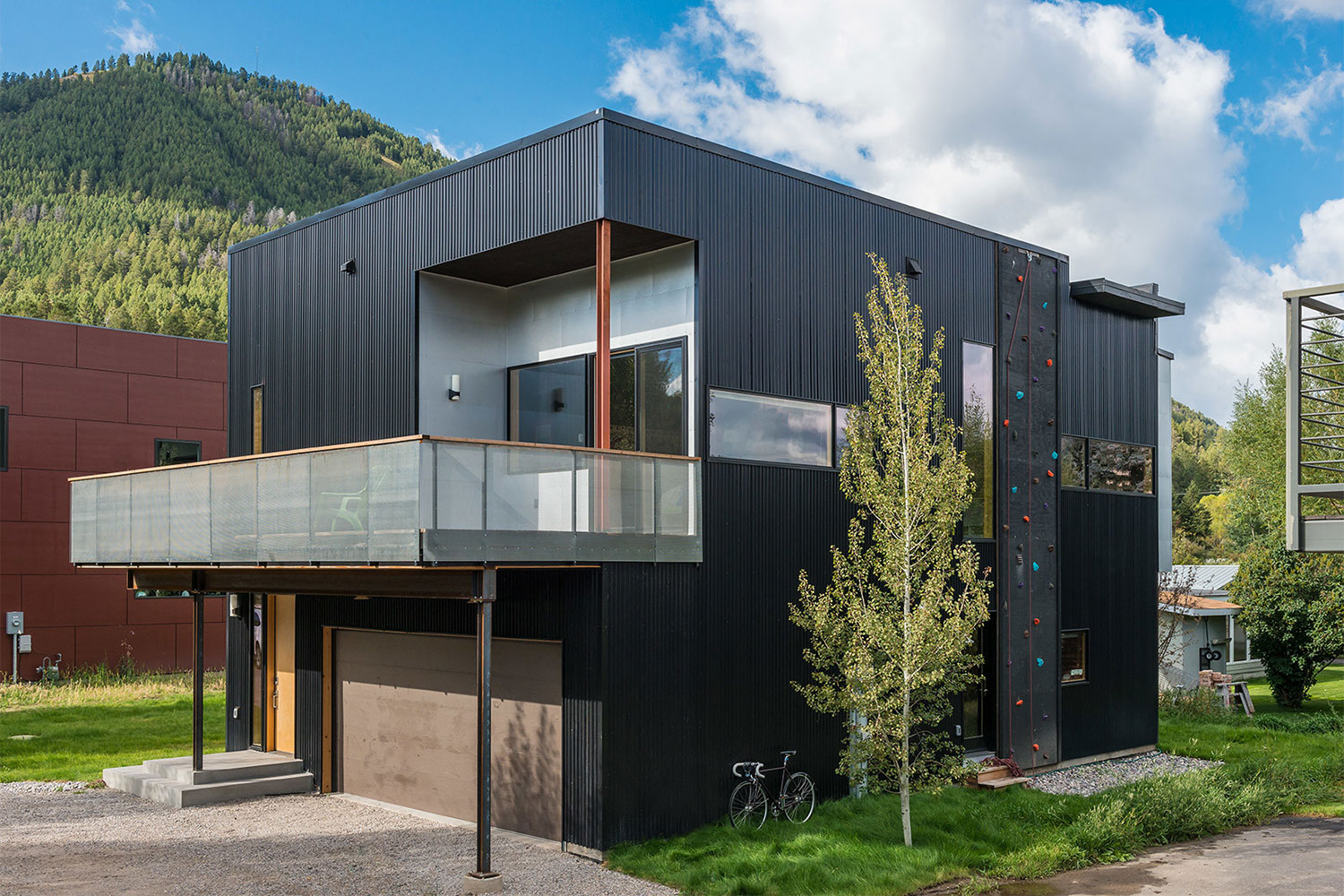 jackson hole area home features exterior rock climbing wall cache creek residence carney logan burke architects 004