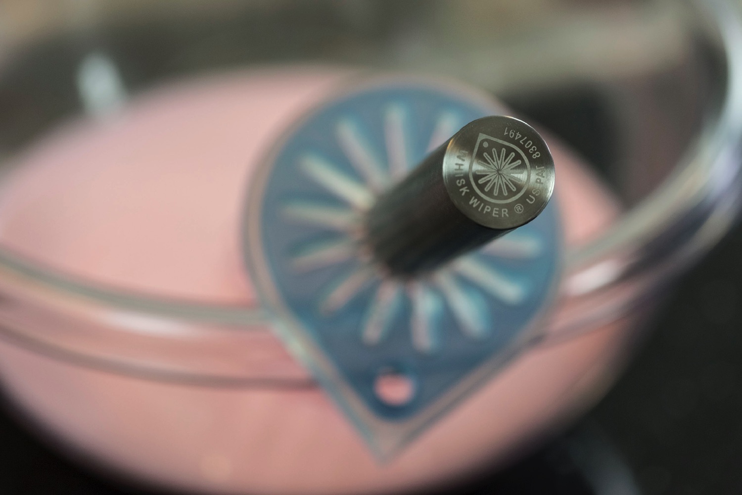 whisk wiper kickstarter mounted on bowl bottom closeup