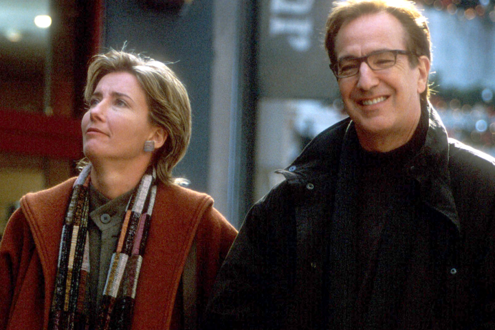 A couple walk and smile in a scene from Love Actually.