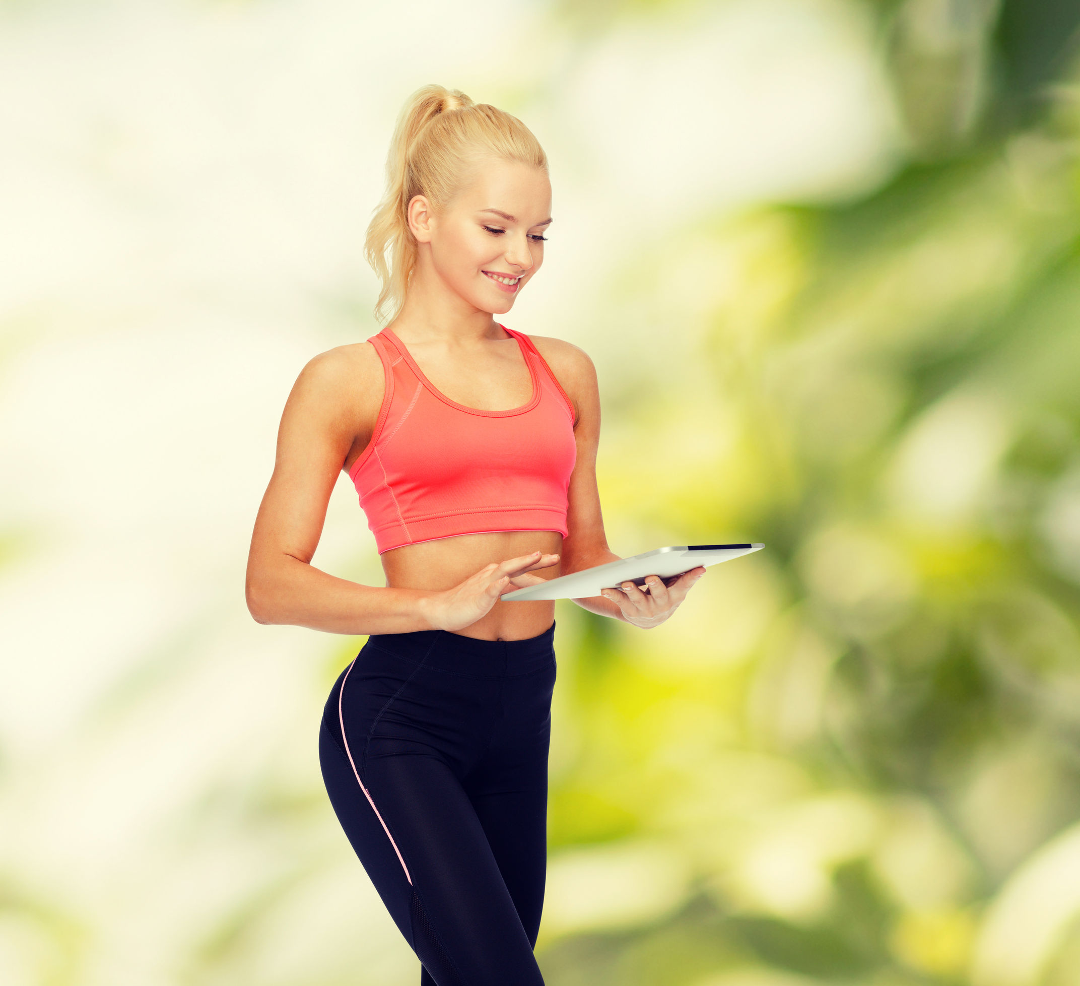 Woman workout training with app and ipad.