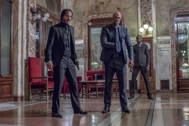 Two men stand next to each other in John Wick: chapter 2.