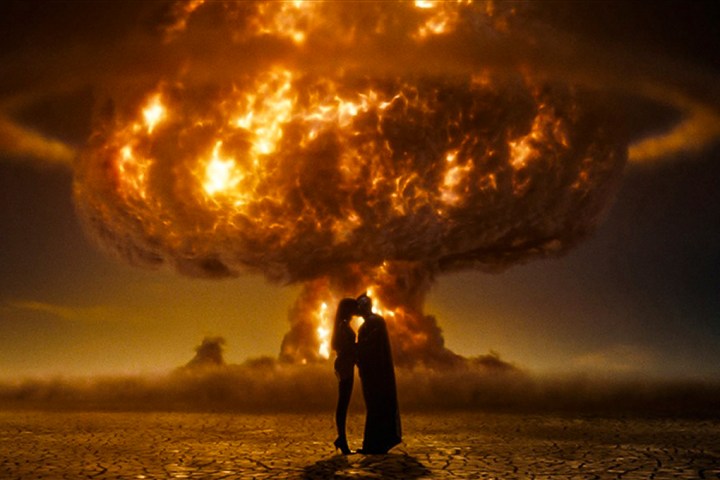 Nite Owl and Silk Specter in front of a nuclear explosion in "Watchmen."