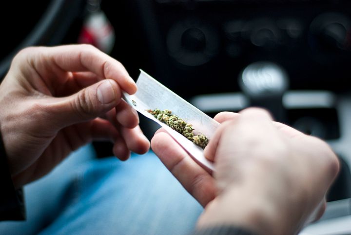 dea synethetic marijuana safer than weed 59953123  man making joint and a stash of in the car
