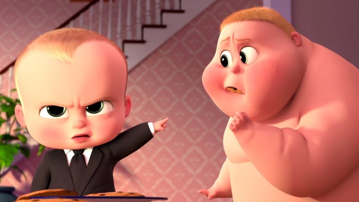 The Boss Baby points at another baby.