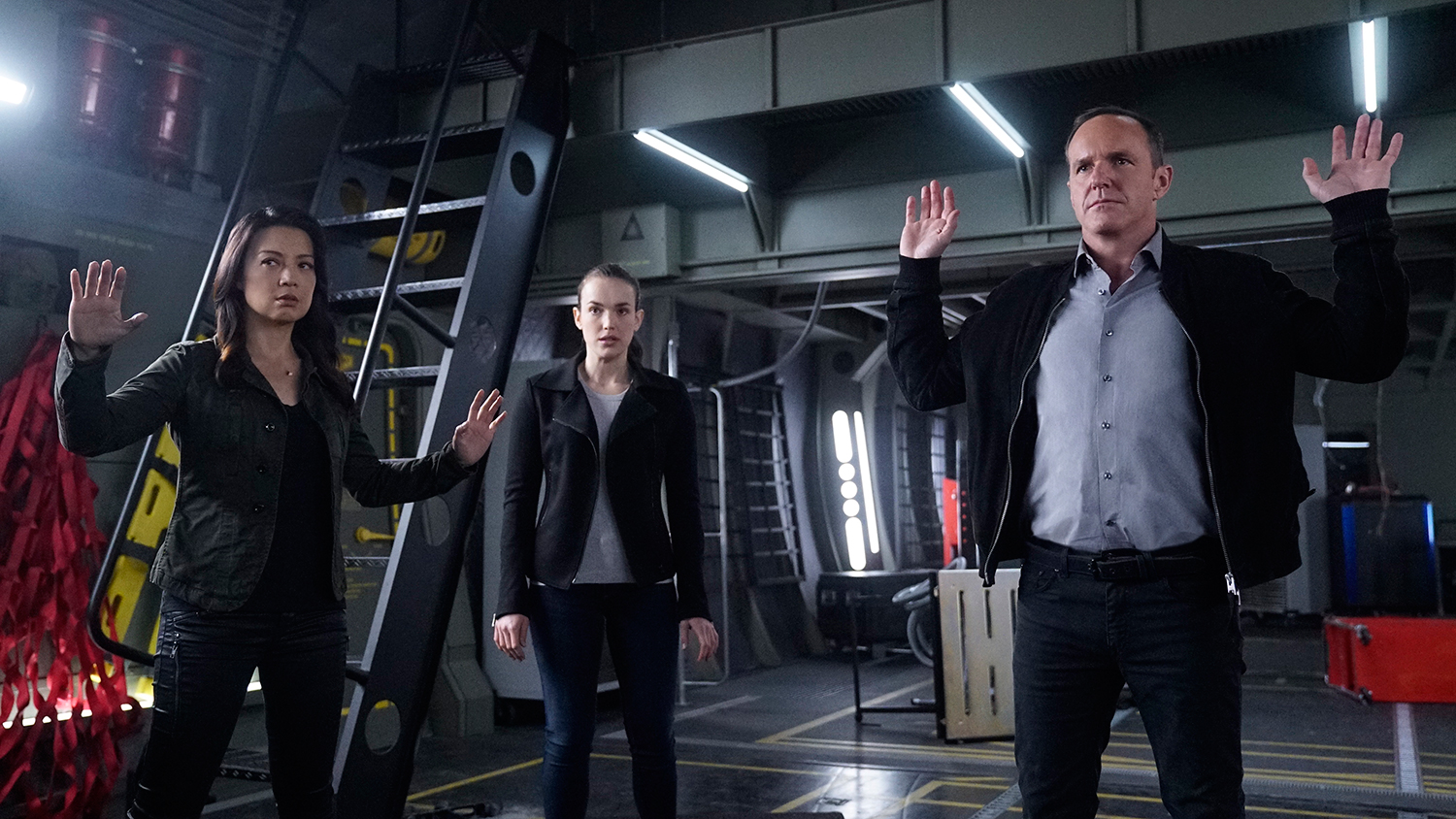 People raise their hands in Marvel's Agents of S.H.I.E.L.D.