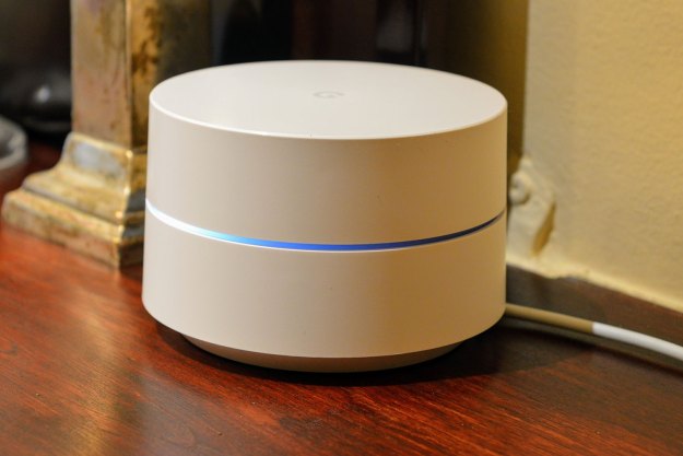 The Google Wifi device with light coming from the center.