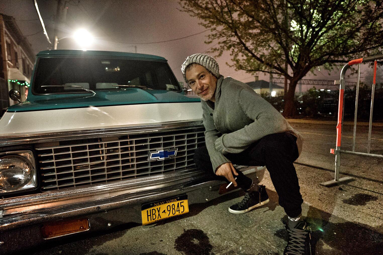 Matisyahu posing with car