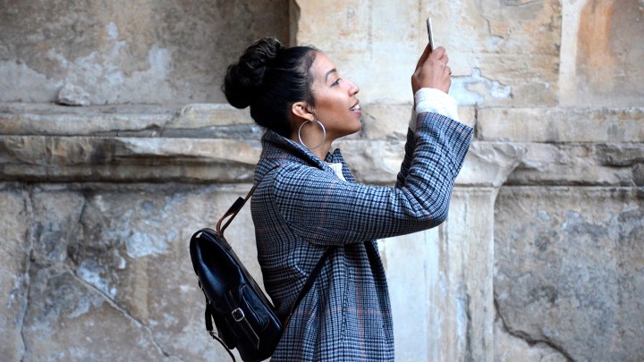 woman looking at mobile phone