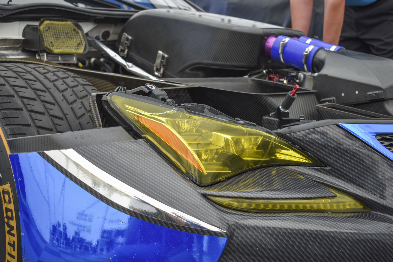 Close up detail shot of the Lexus RC F GT3 showing off the front right headlight and engine