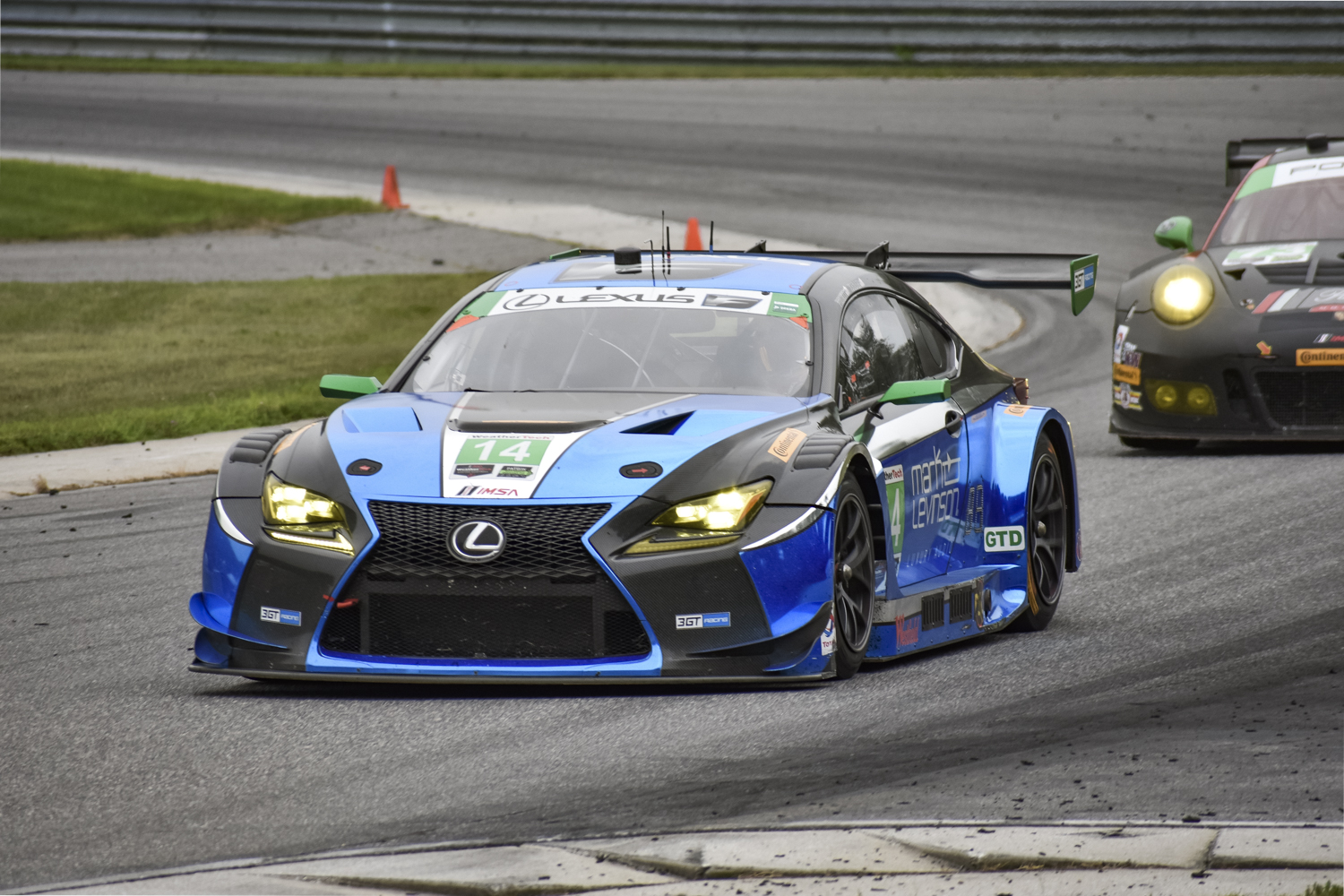 Lexus RC F GT3 rounding a corner being tailed by another car