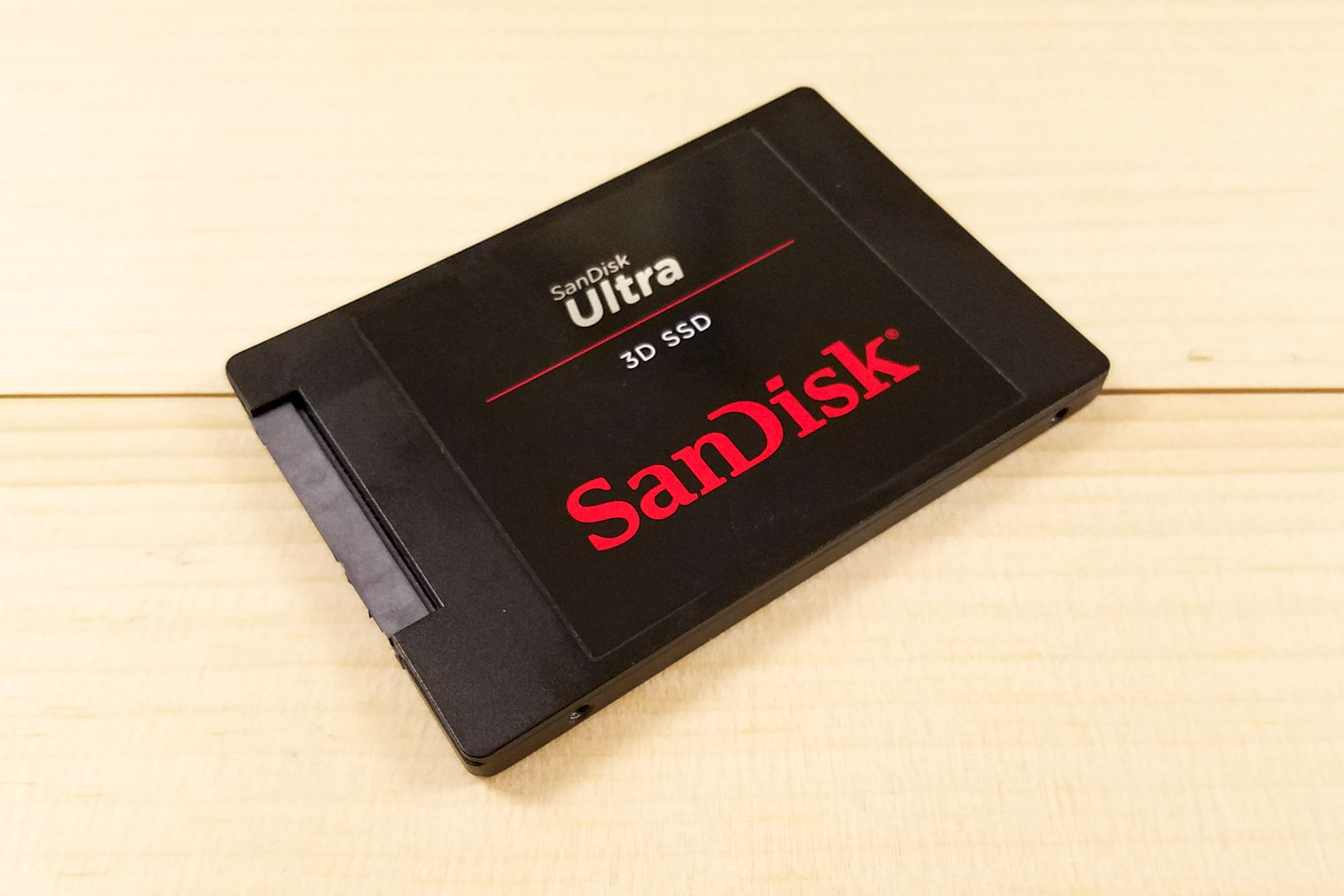 SanDisk Ultra 3D SSD sitting flat on a table angled at 45 degrees