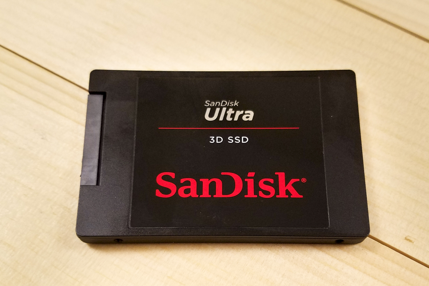 SanDisk Ultra 3D SSD sitting flat on a table