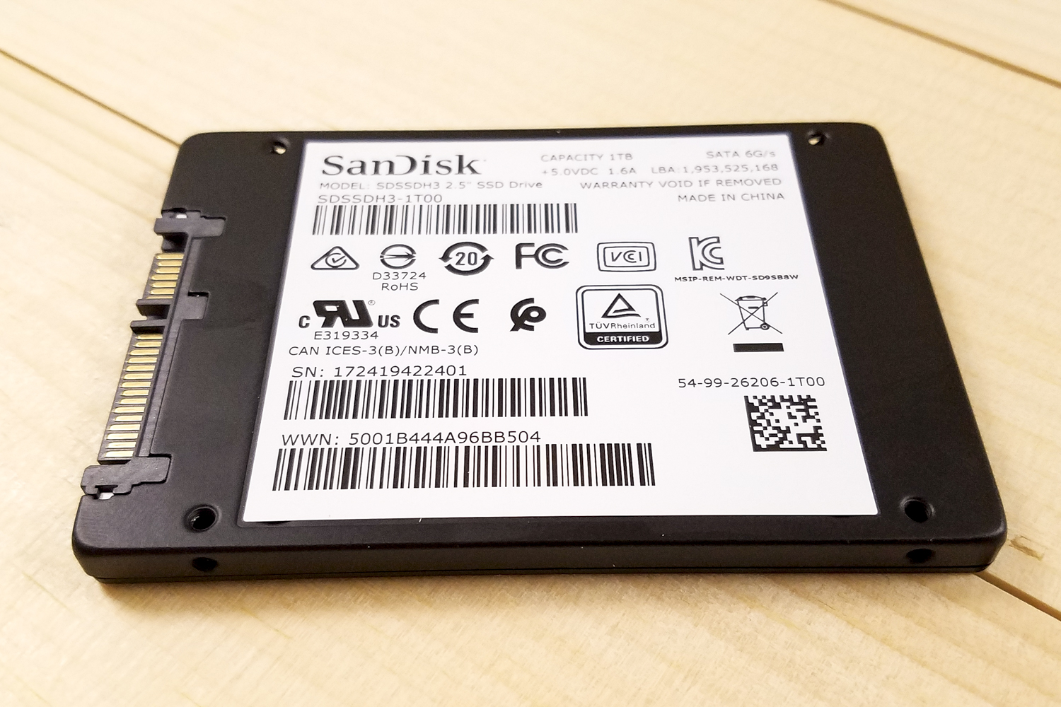SanDisk Ultra 3D SSD sitting upside-down on a table