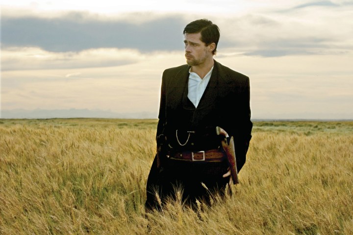 Brad Pitt stands in a wheat field in The Assassination of Jesse James by the Coward Robert Ford.