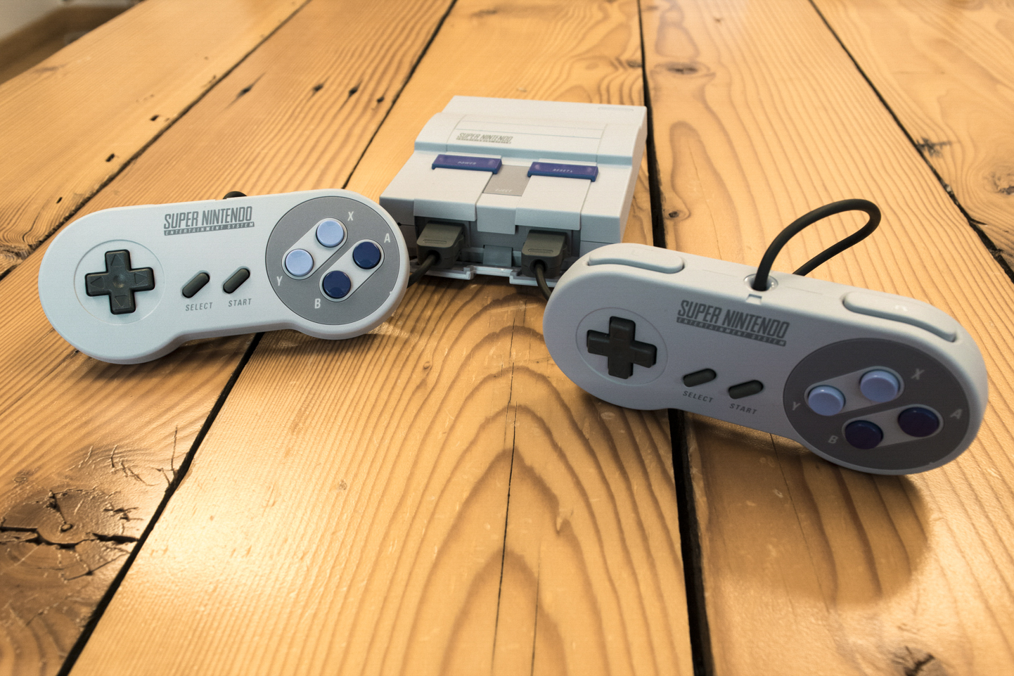 Both controllers in front of the SNES Classic Edition