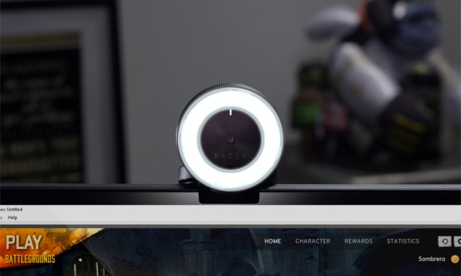 Razer webcam sitting on top of a monitor.
