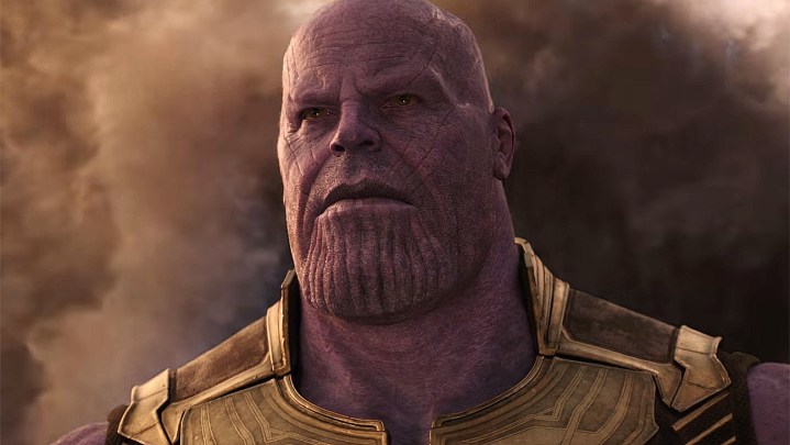 Thanos looking serious with smoke behind him in Avengers Infinity War.