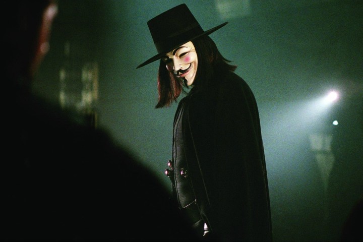 A man in a mask bows in V for Vendetta.