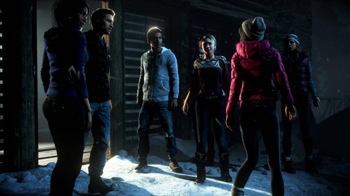 The main characters in the game Until Dawn gathered and talking to each other.