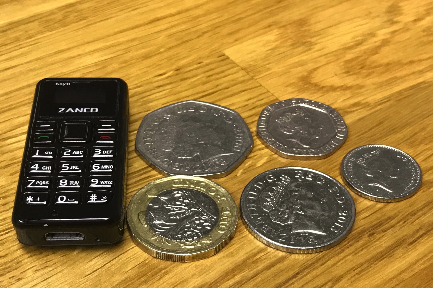 worlds tiniest cellphone kickstarter zanco tiny t1 with coins