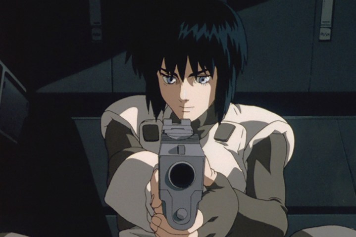 A character points a gun at the camera in Ghost in the Shell.