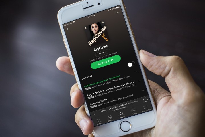 Spotify Rap Caviar playlist displayed on an iPhone.