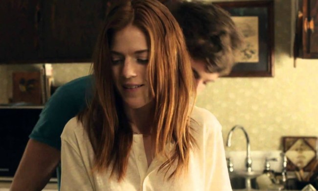 Rose Leslie as Bea being hugged by a man in the film Honeymoon.