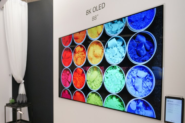 An LG 8K 88 inch OLED hanging on a wall.