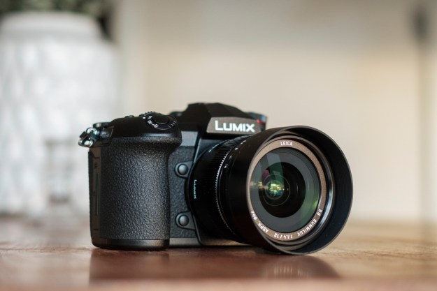 Panasonic Lumix G9 Review | Hero shot of the camera on a table facing the left side of the frame