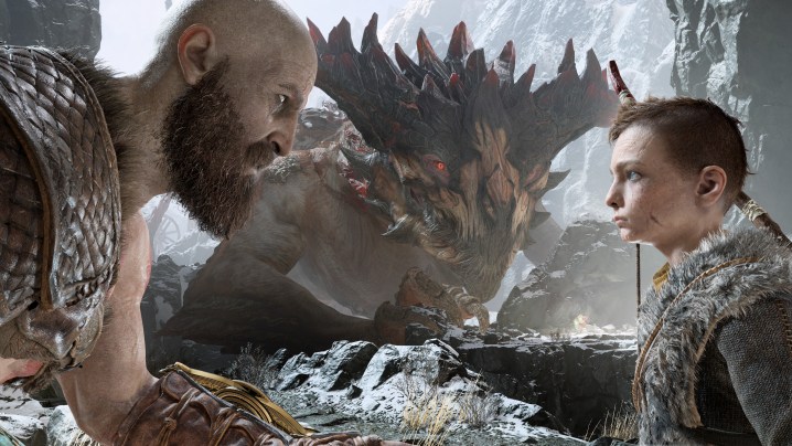 God of War Review | Kratos and Atreus having an emotional conversation in front of a large beast