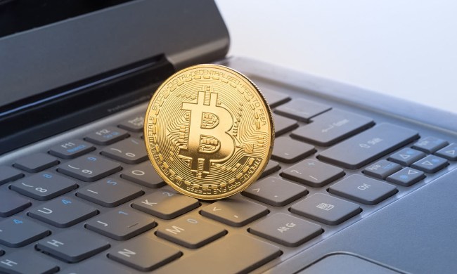 Large Bitcoin on a laptop keyboard