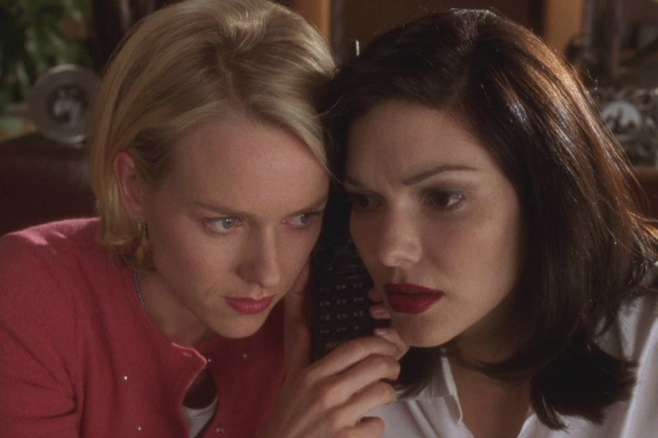 Naomi Watts and Laura Harring listening to a phone in Mulholland Drive.