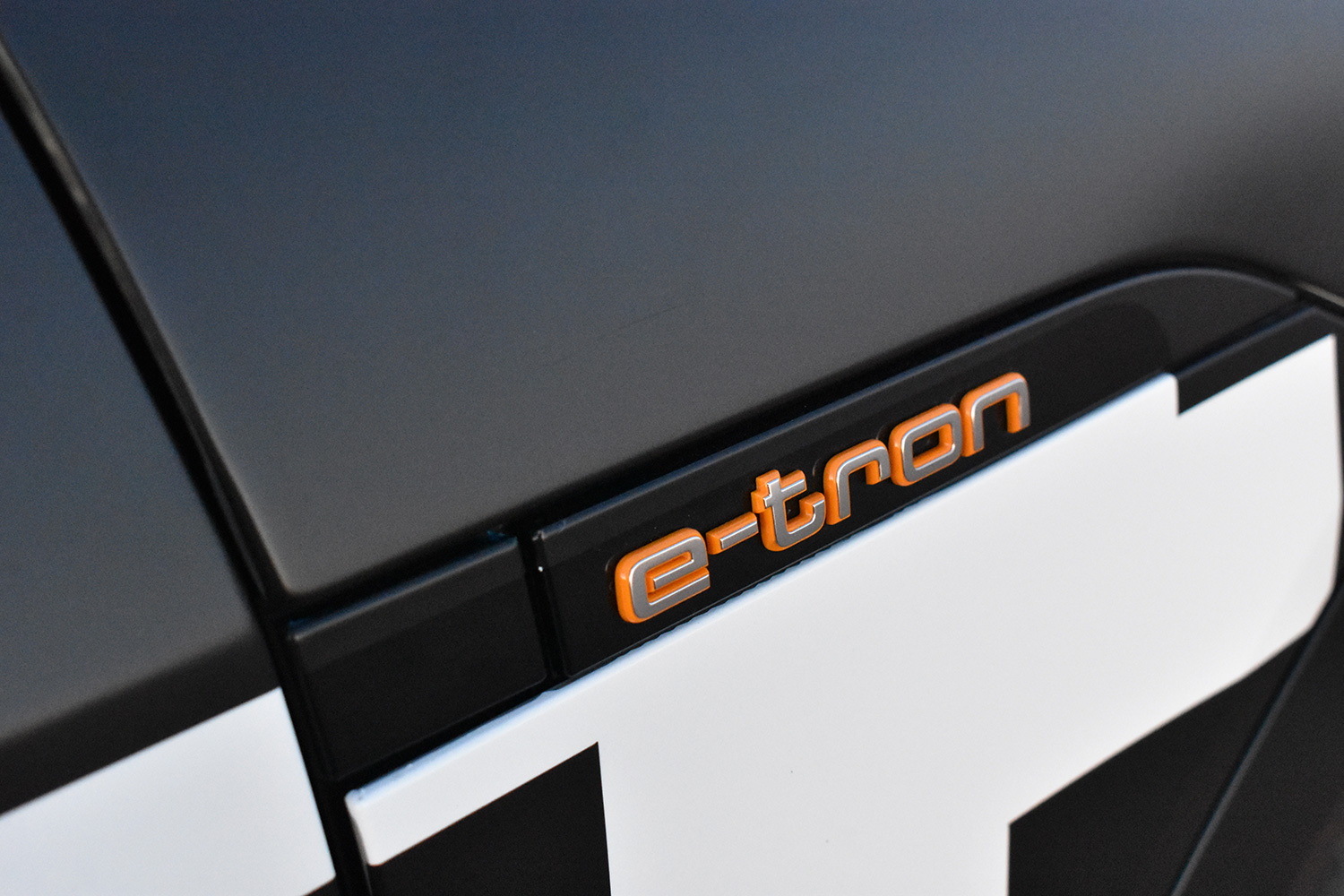 Audi E-Tron Electric SUV model logo