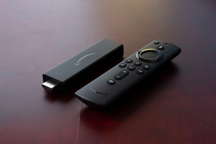 The Amazon Fire TV Streaming Stick 4K on a wooden table.