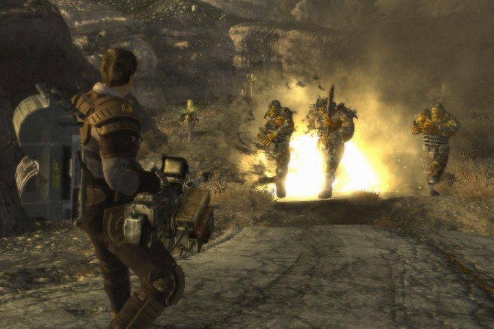 A man shooting an explosive at two raiders.