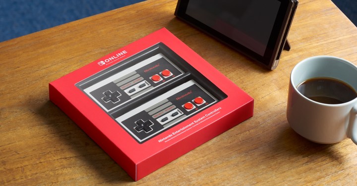 Exclusive NES wireless controllers packaged on a table.