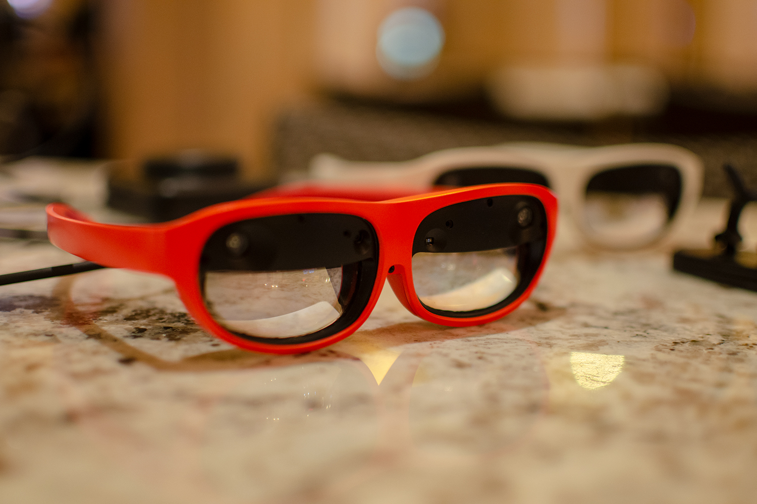 Nreal glasses sit on a table.