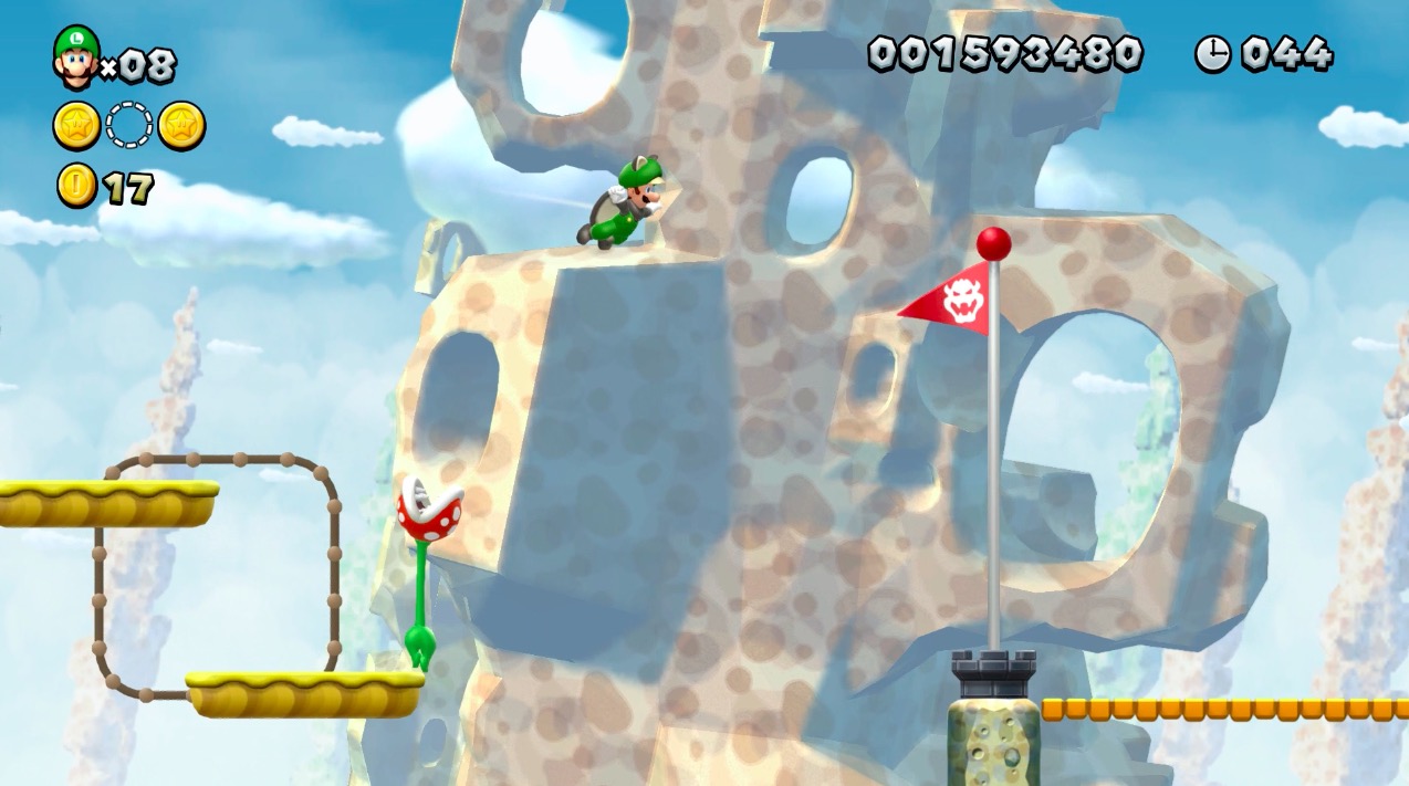 Luigi floats toward the goal in New Super Mario Bros. U Deluxe.